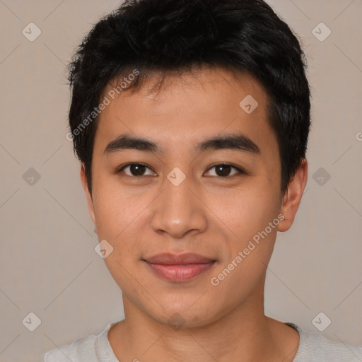 Joyful asian young-adult male with short  black hair and brown eyes