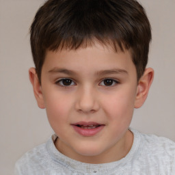 Joyful white child male with short  brown hair and brown eyes