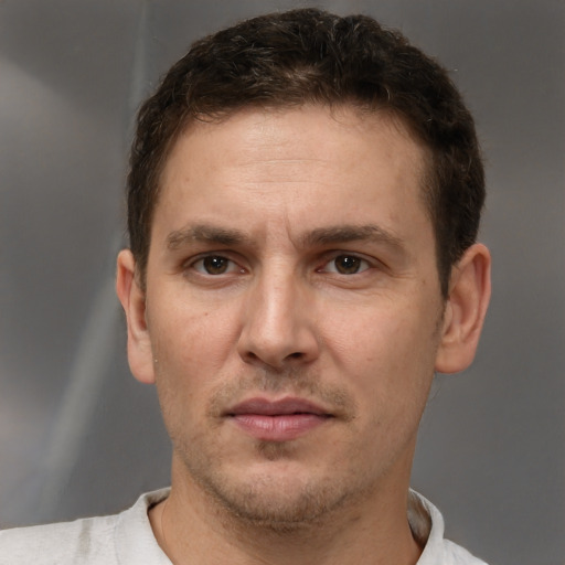 Neutral white adult male with short  brown hair and brown eyes