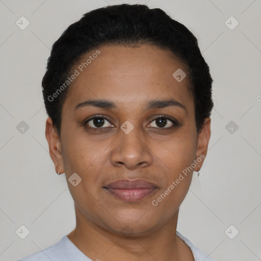 Joyful black young-adult female with short  black hair and brown eyes