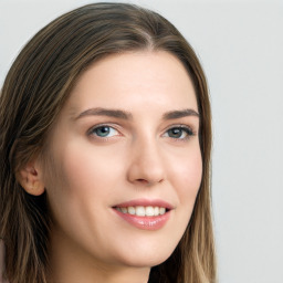 Joyful white young-adult female with long  brown hair and blue eyes