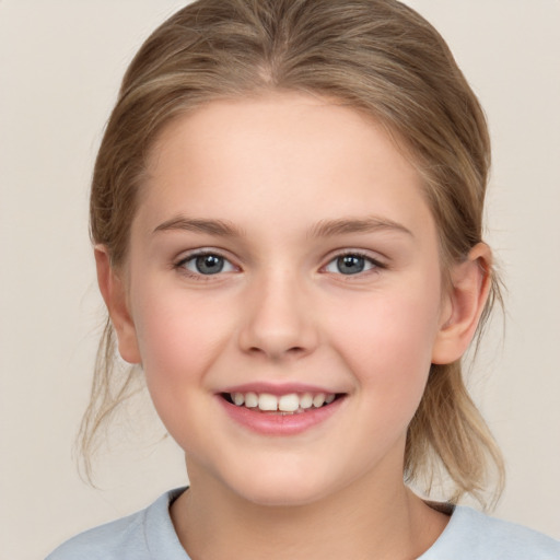 Joyful white child female with medium  brown hair and brown eyes