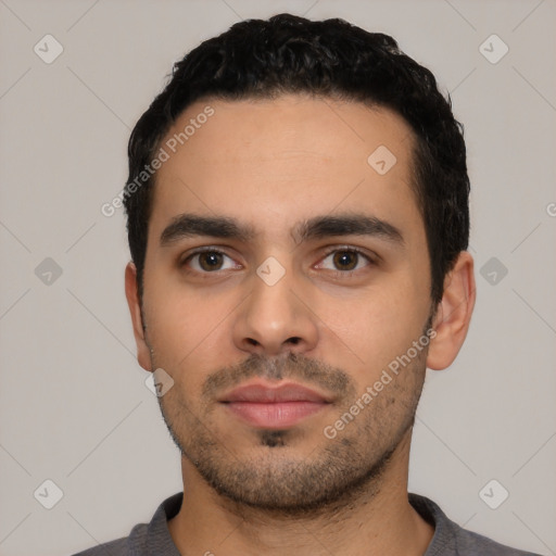 Neutral latino young-adult male with short  black hair and brown eyes