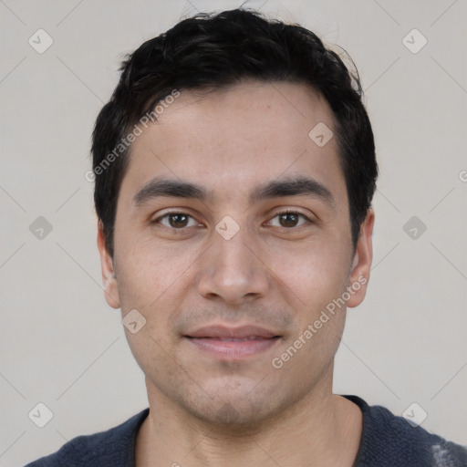 Joyful white young-adult male with short  black hair and brown eyes