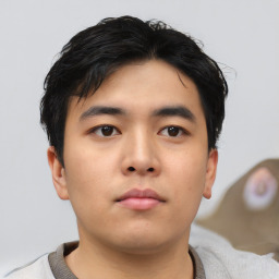 Neutral asian young-adult male with short  black hair and brown eyes