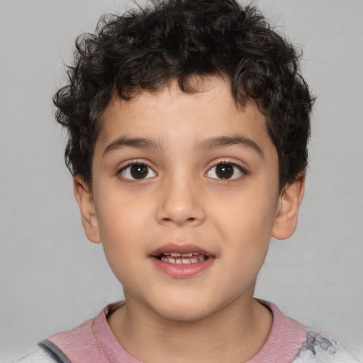 Joyful white child male with short  brown hair and brown eyes