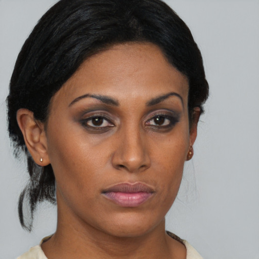 Neutral asian young-adult female with medium  brown hair and brown eyes