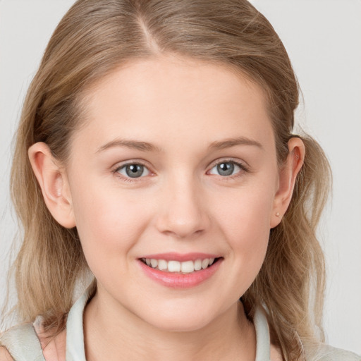 Joyful white young-adult female with medium  brown hair and blue eyes