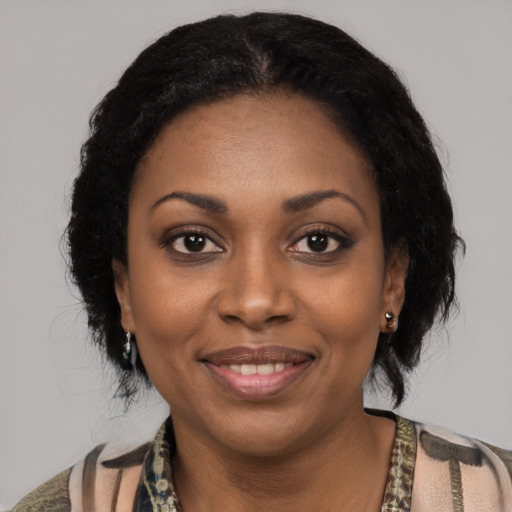 Joyful latino young-adult female with medium  black hair and brown eyes