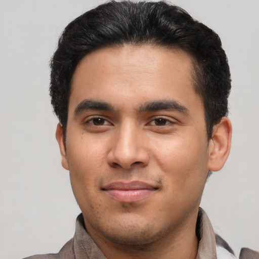 Joyful asian young-adult male with short  brown hair and brown eyes