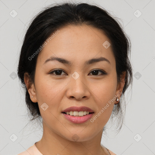 Joyful asian young-adult female with medium  brown hair and brown eyes