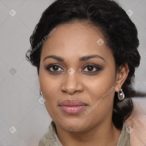 Joyful black young-adult female with long  black hair and brown eyes
