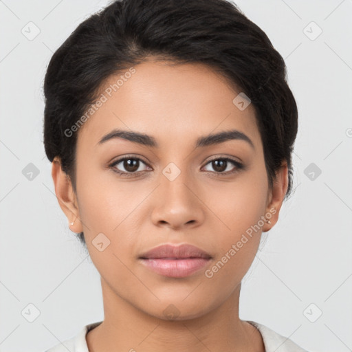 Joyful latino young-adult female with short  black hair and brown eyes