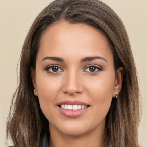 Joyful white young-adult female with long  brown hair and brown eyes