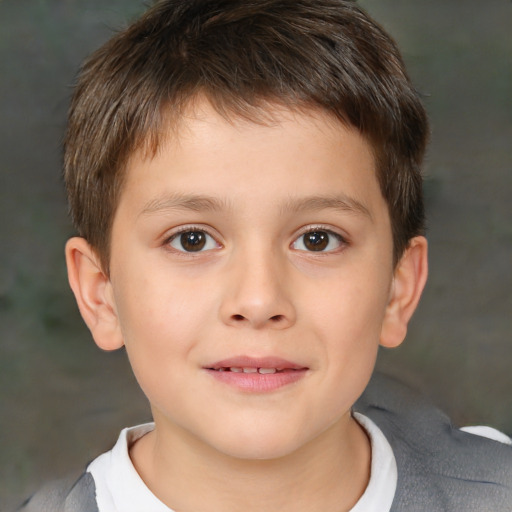 Joyful white child male with short  brown hair and brown eyes