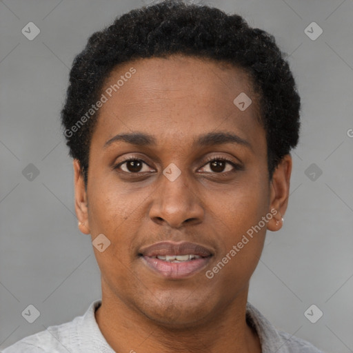 Joyful black young-adult male with short  brown hair and brown eyes