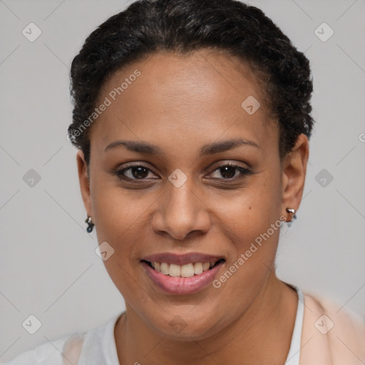 Joyful black young-adult female with short  brown hair and brown eyes