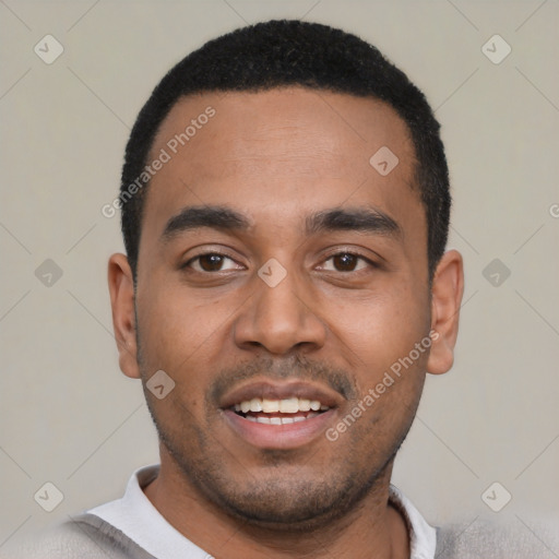 Joyful black young-adult male with short  black hair and brown eyes
