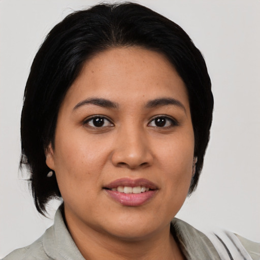 Joyful asian young-adult female with medium  black hair and brown eyes