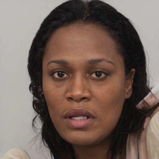 Neutral black young-adult female with long  black hair and brown eyes