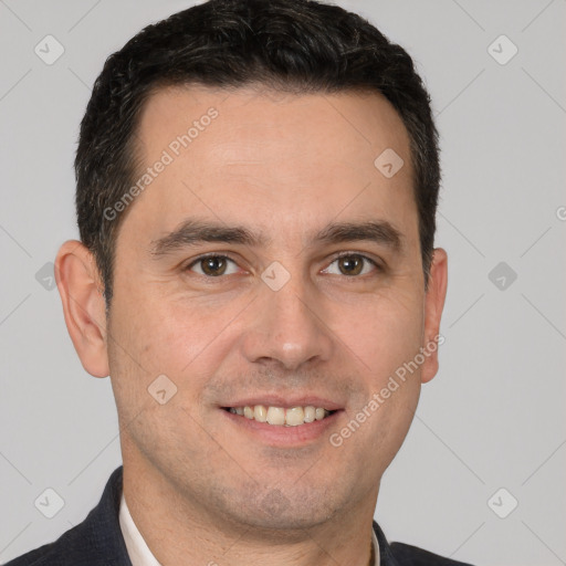 Joyful white young-adult male with short  brown hair and brown eyes