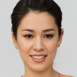 Joyful asian young-adult female with short  brown hair and brown eyes