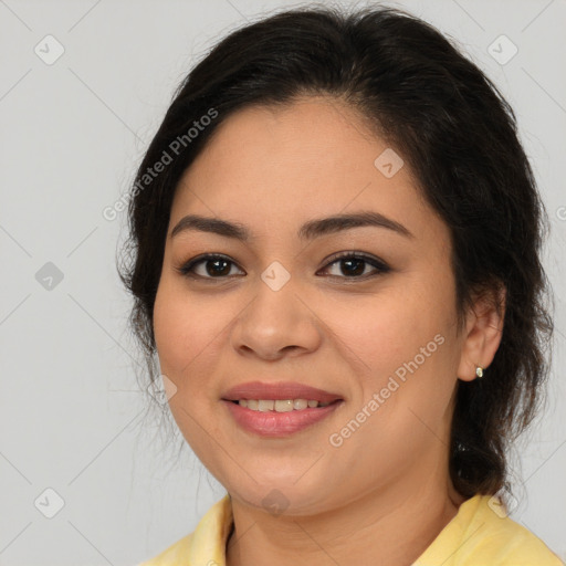 Joyful latino young-adult female with medium  brown hair and brown eyes