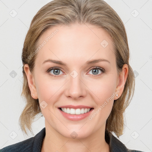 Joyful white young-adult female with medium  brown hair and blue eyes