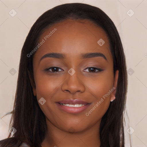 Joyful black young-adult female with long  brown hair and brown eyes