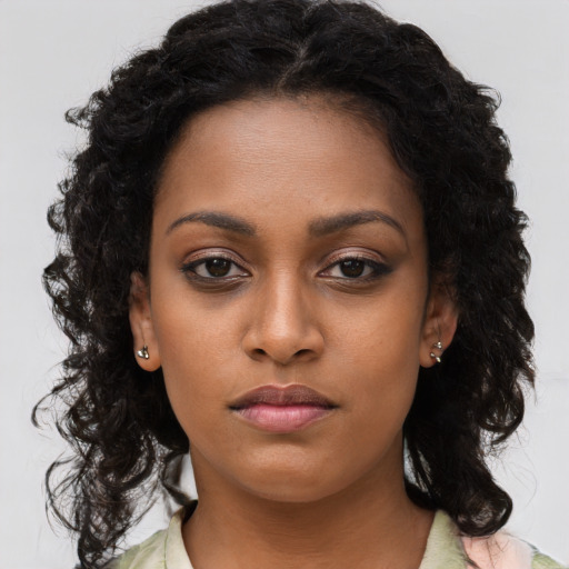 Neutral black young-adult female with long  brown hair and brown eyes