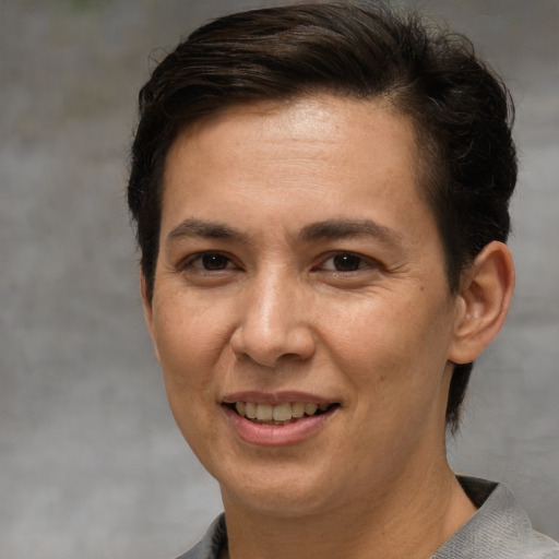 Joyful white adult female with short  brown hair and brown eyes