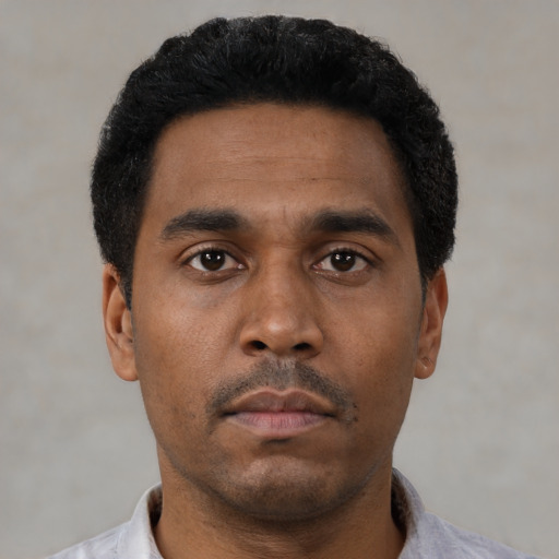 Neutral black young-adult male with short  black hair and brown eyes
