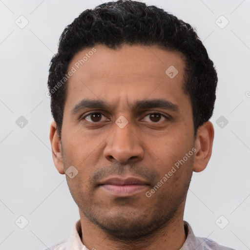 Neutral latino young-adult male with short  black hair and brown eyes