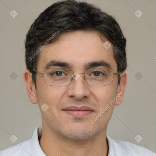 Joyful white adult male with short  brown hair and brown eyes