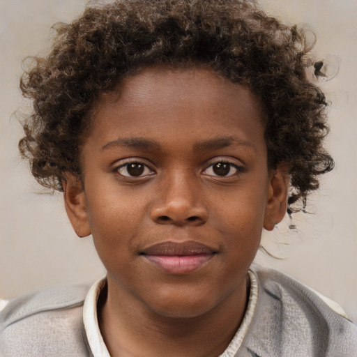 Joyful black child male with short  brown hair and brown eyes