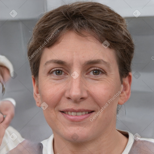 Joyful white adult female with short  brown hair and grey eyes