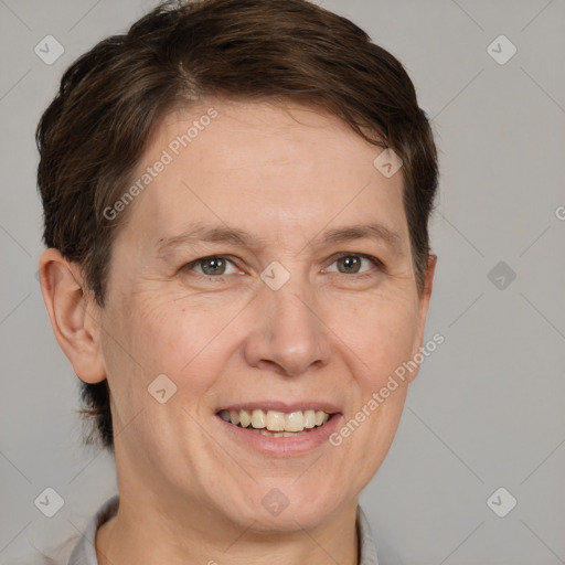 Joyful white adult female with short  brown hair and brown eyes