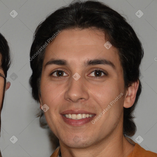 Joyful white young-adult male with medium  brown hair and brown eyes