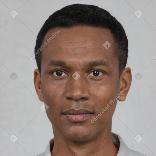 Neutral black young-adult male with short  black hair and brown eyes