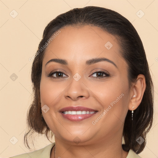 Joyful latino young-adult female with medium  brown hair and brown eyes