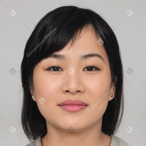 Joyful asian young-adult female with medium  black hair and brown eyes