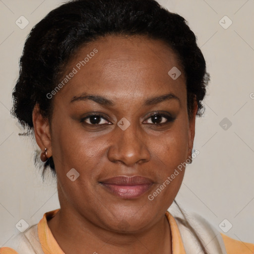 Joyful black adult female with short  brown hair and brown eyes