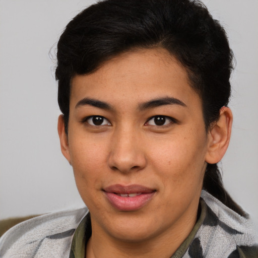 Joyful asian young-adult female with short  brown hair and brown eyes