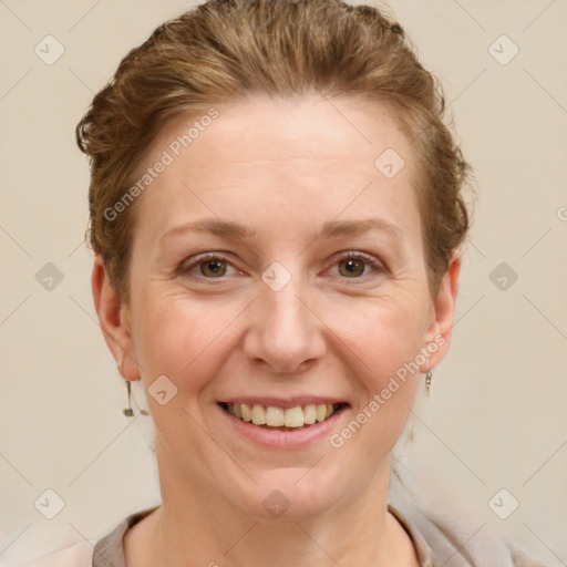 Joyful white adult female with short  brown hair and brown eyes