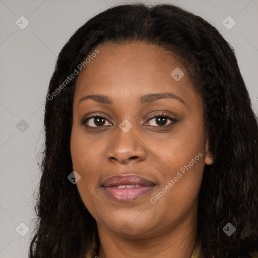 Joyful black young-adult female with long  brown hair and brown eyes