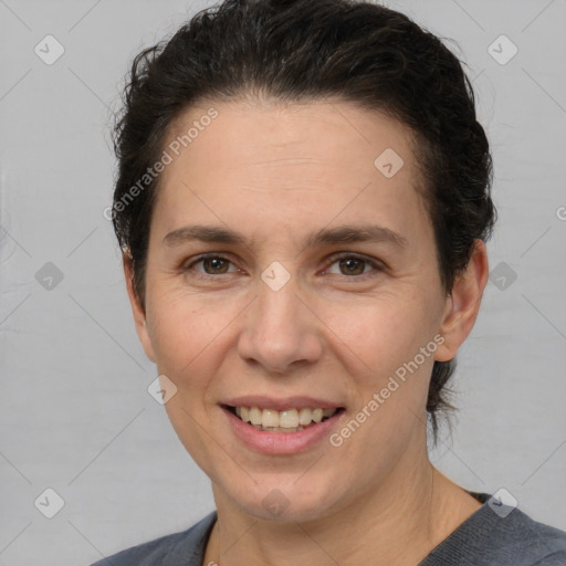 Joyful white adult female with short  brown hair and brown eyes