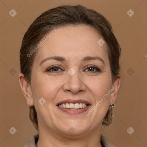 Joyful white adult female with medium  brown hair and brown eyes