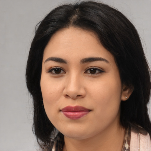 Joyful asian young-adult female with long  black hair and brown eyes