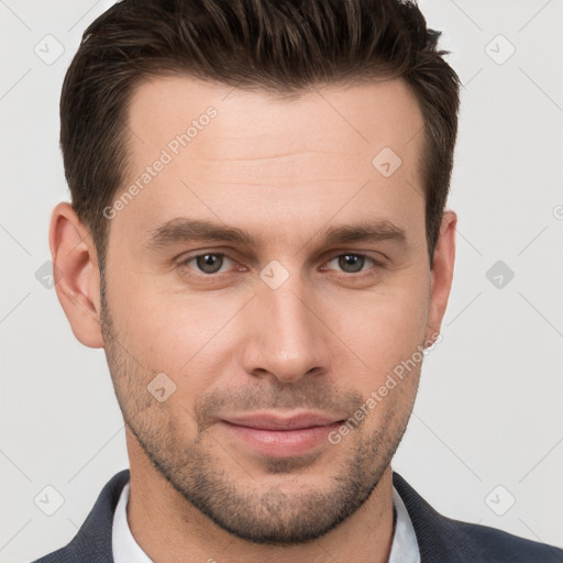 Joyful white young-adult male with short  brown hair and grey eyes