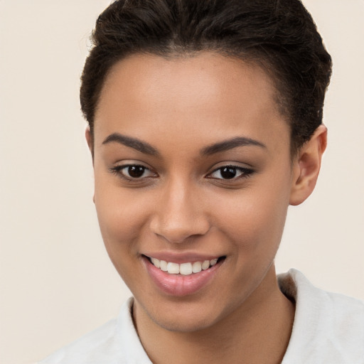 Joyful white young-adult female with short  brown hair and brown eyes